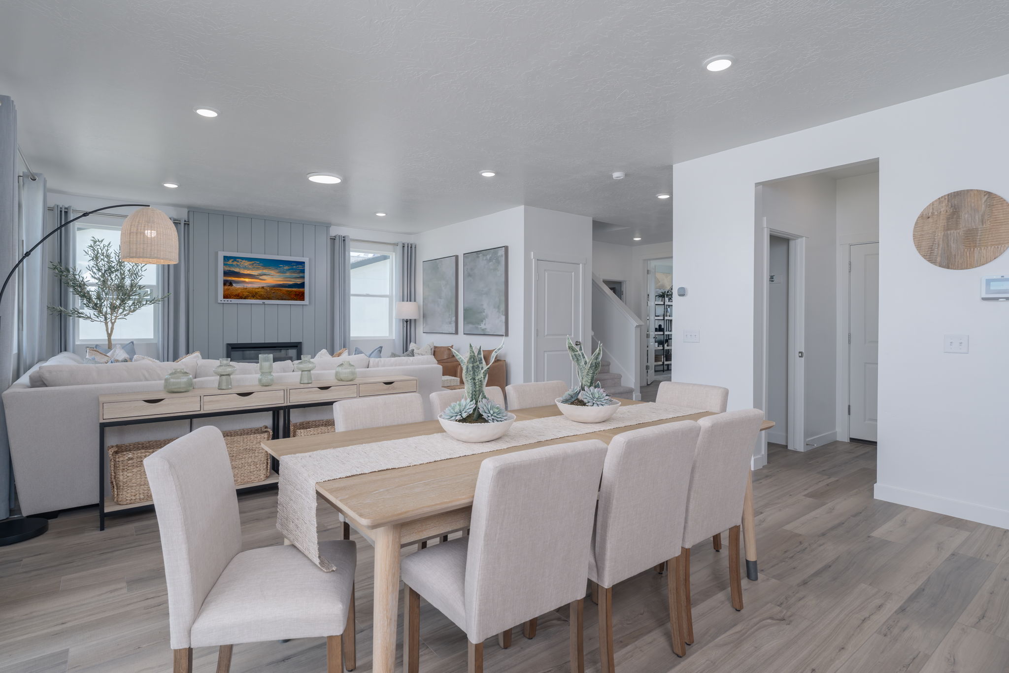 A dining room with a large table.