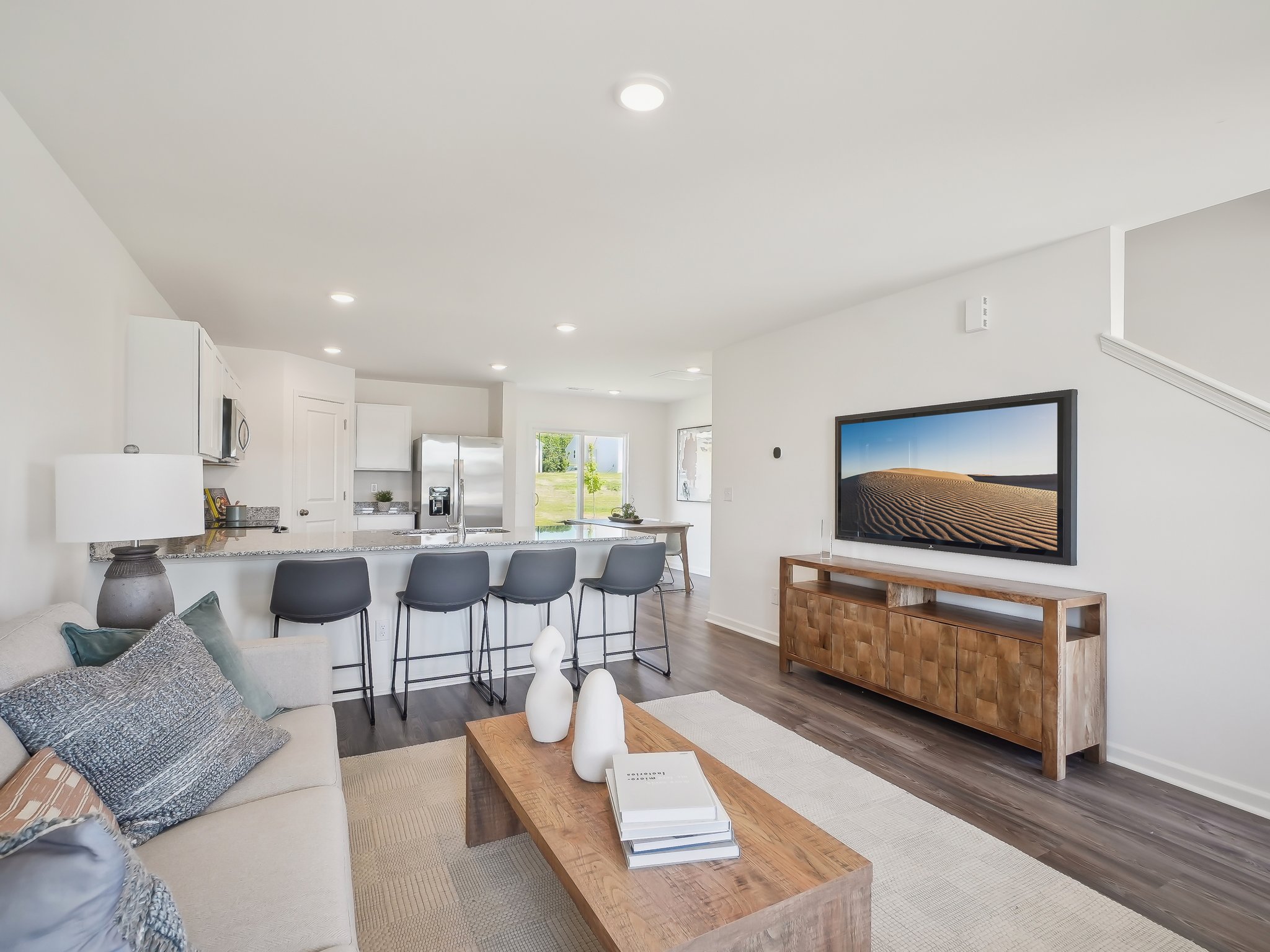 A living room with a tv and couches.