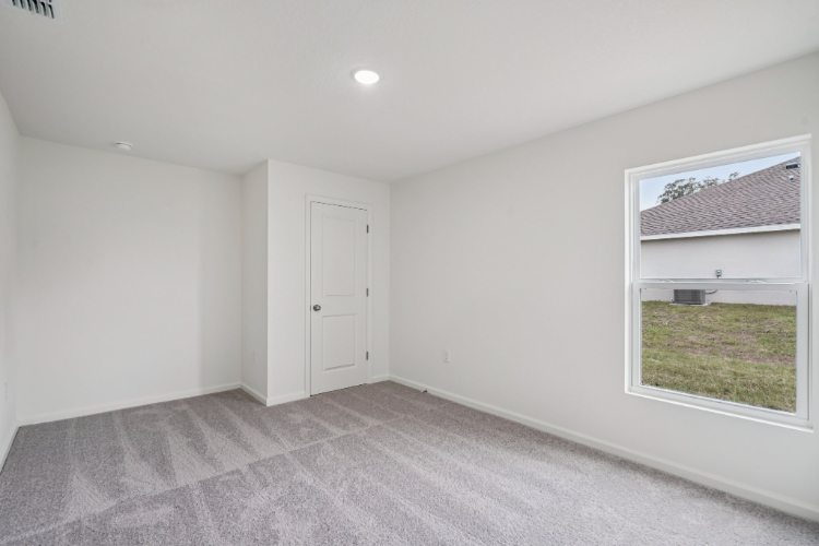 A room with a window and a door.