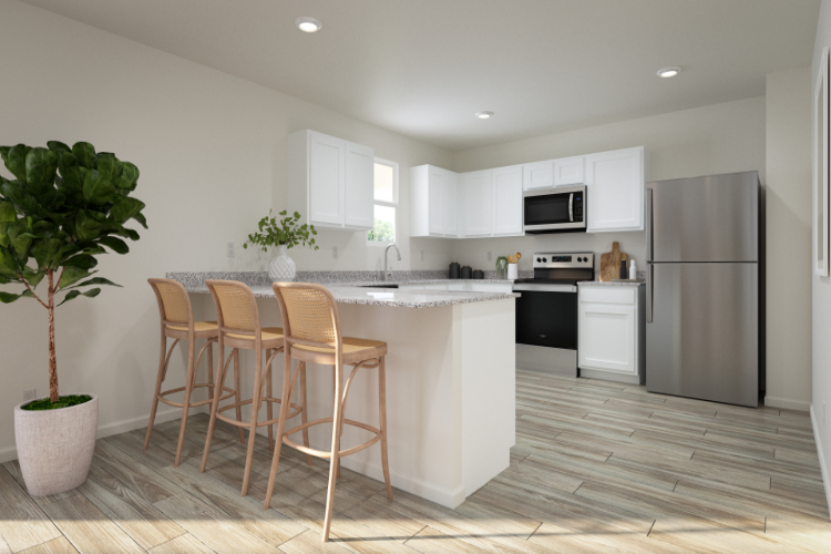 A kitchen with a table and chairs.