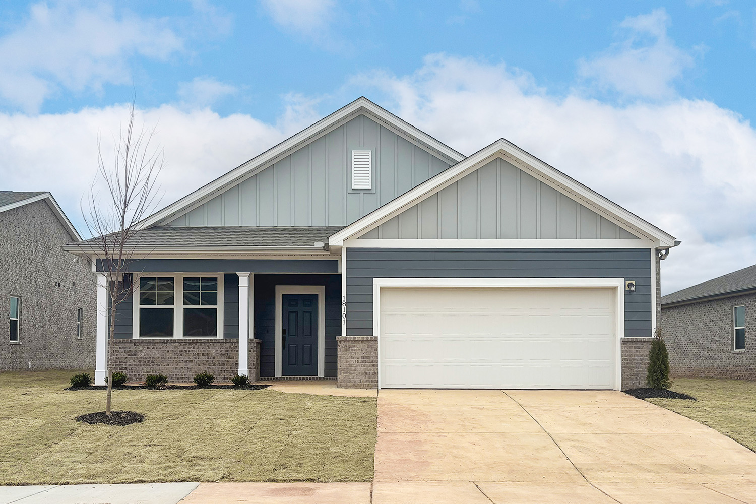 A house with a garage with American Gothic House in the background.