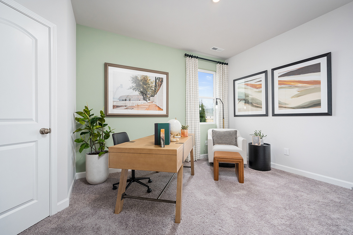 A room with a table and chairs.