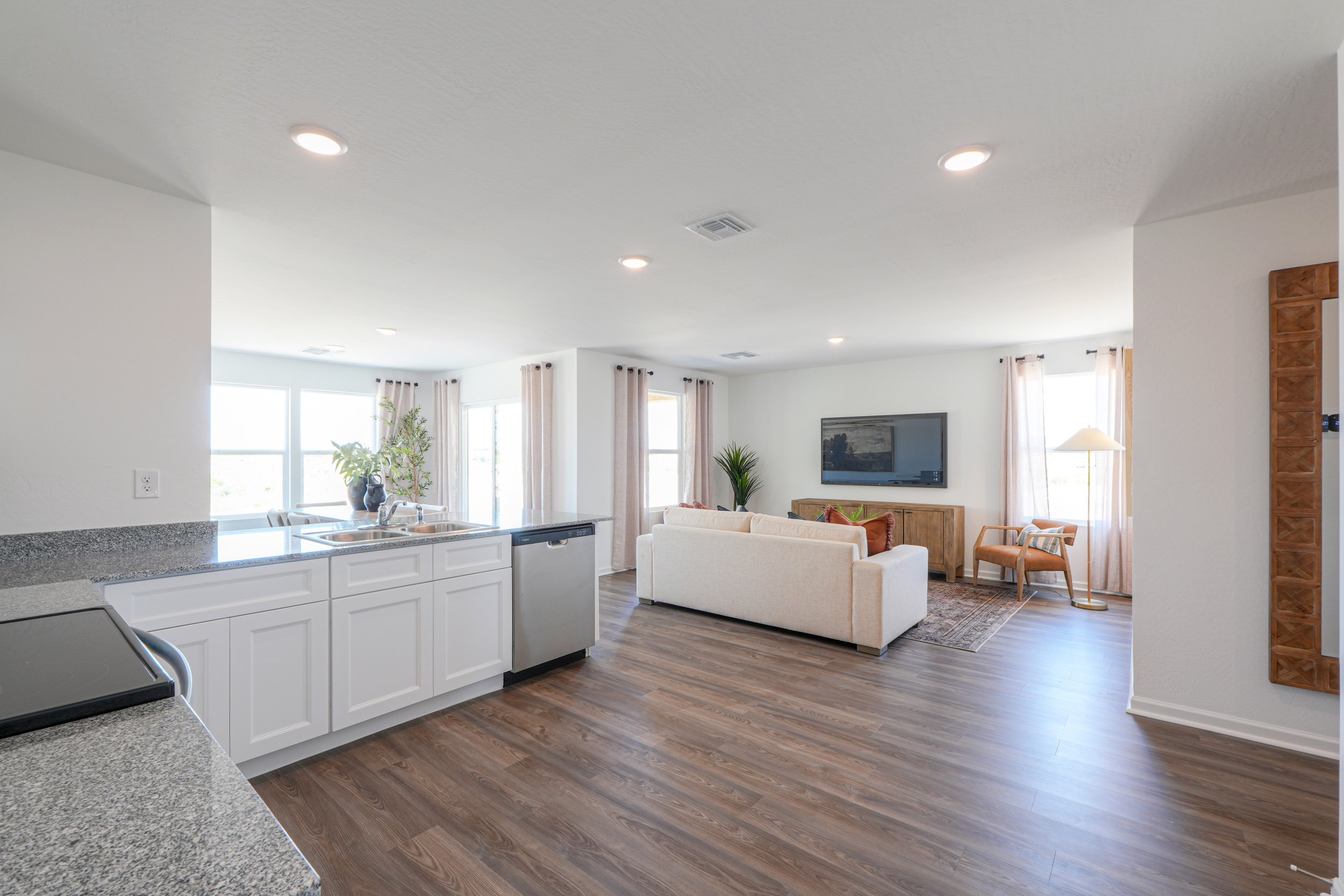 A living room with a large television.