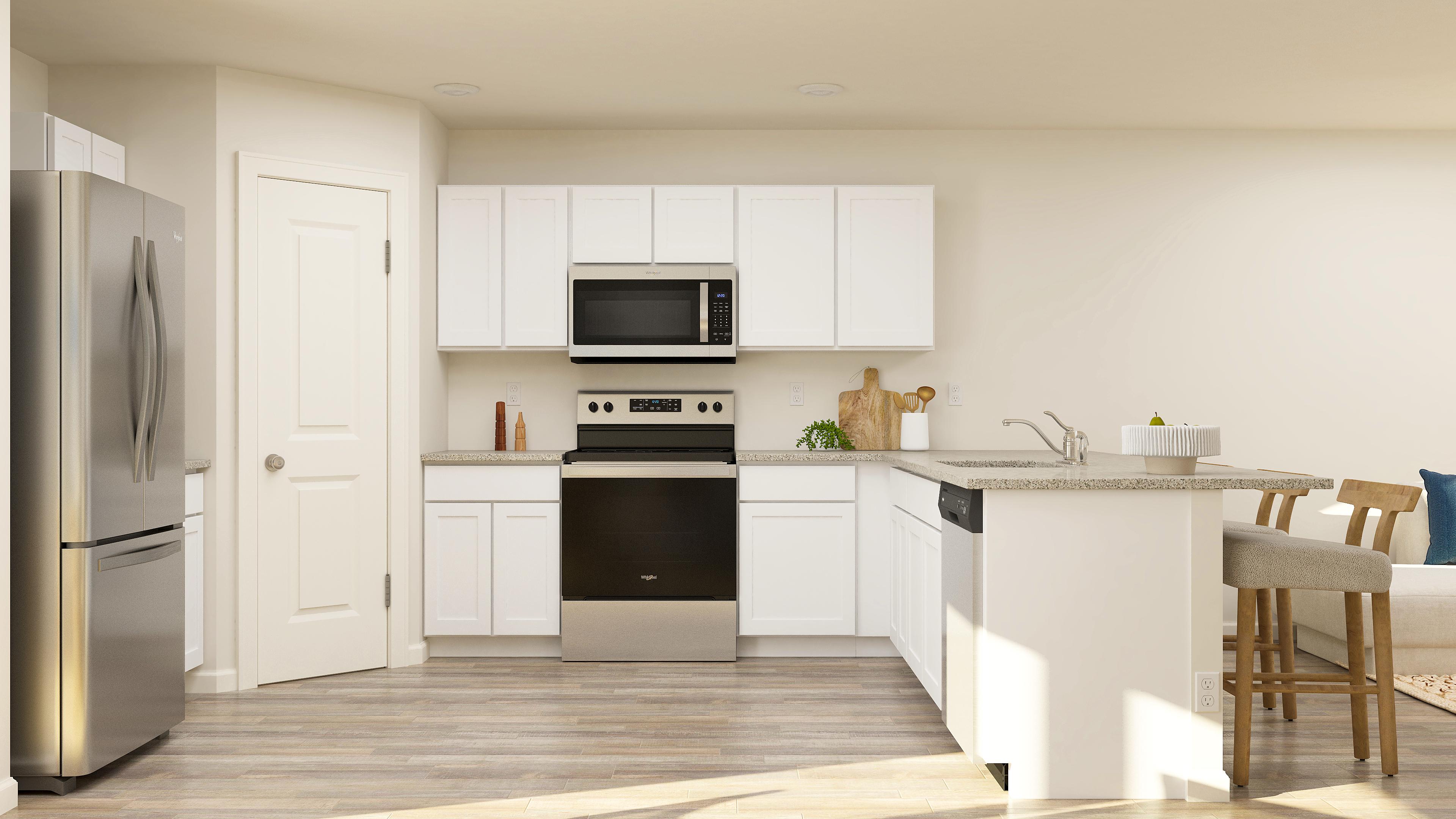 A kitchen with white cabinets.