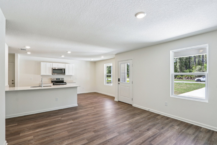 A kitchen with white walls.