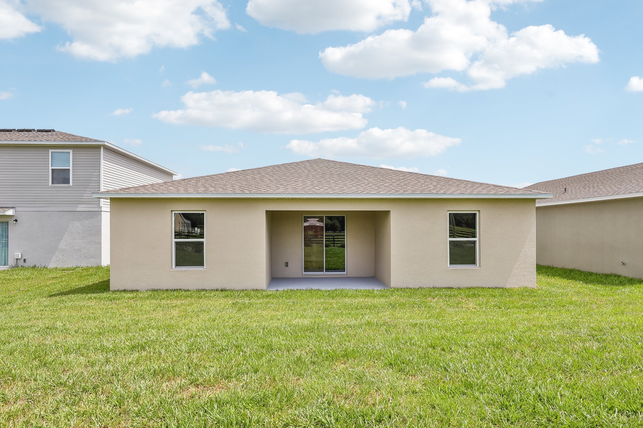 A house with a grass yard.
