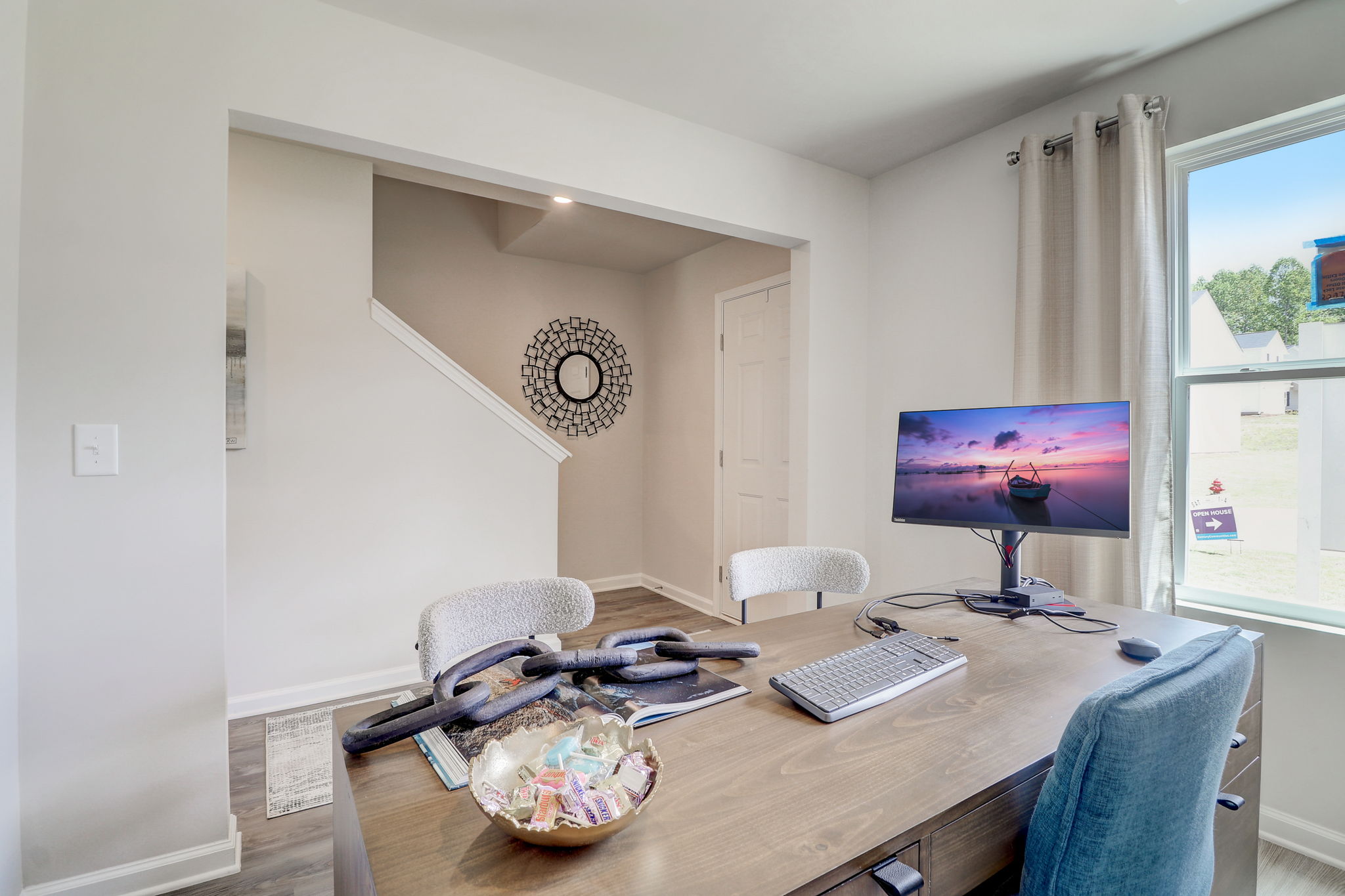 A living room with a tv and a table.