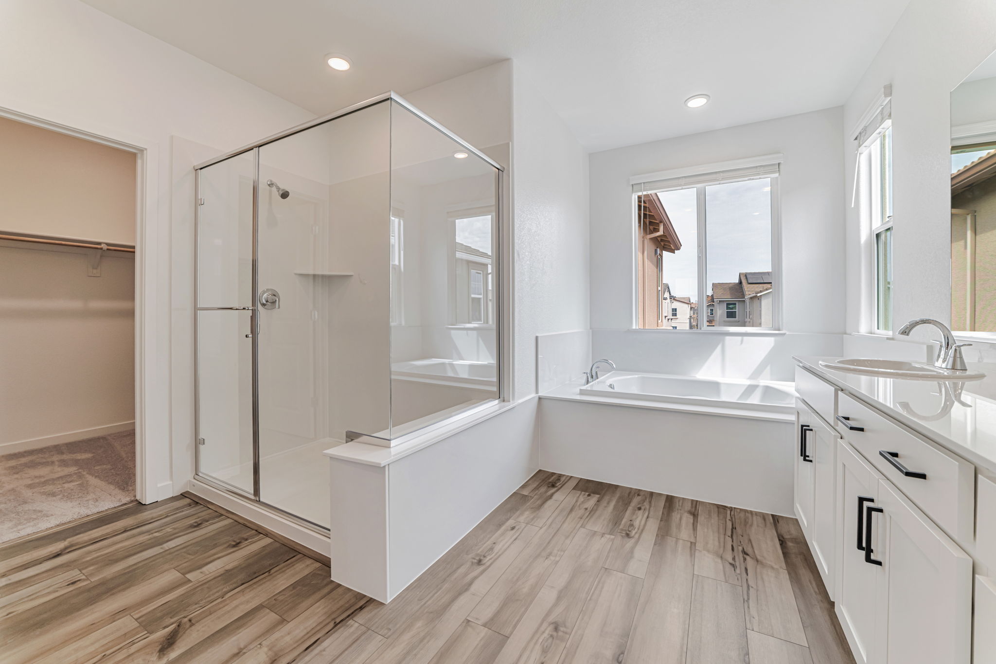 A bathroom with a large glass shower.